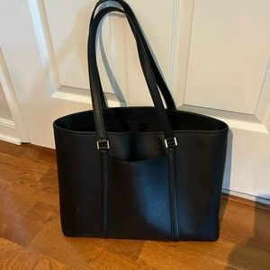 Michael Kors tote. Black leather. Good condition. One strap slightly worn.